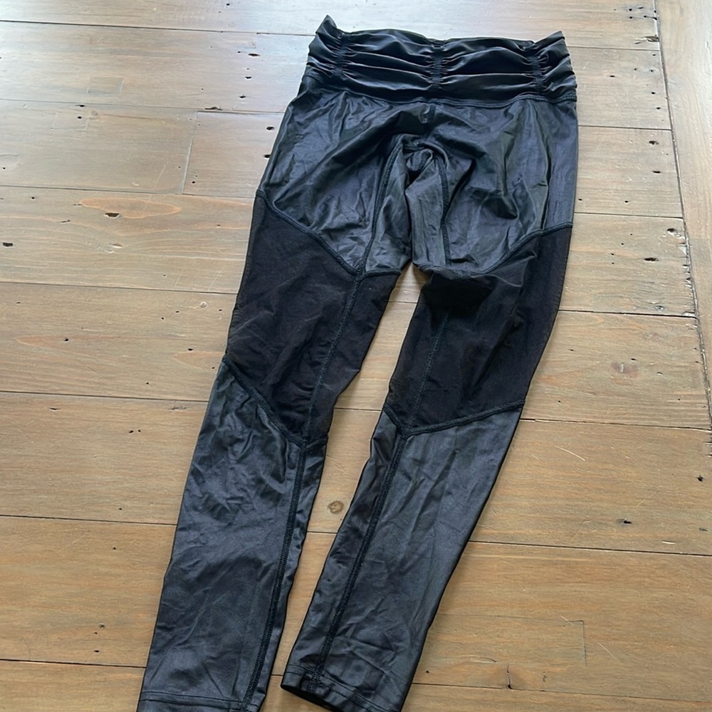 Carbon38 shiney leggings withh mesh on knees and lower thighs. Chill by Will